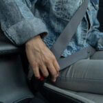 What Is That Little Button On Your Car's Seat Belts For?