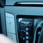 What Is The Little Button Next To Your Car's Gear Shift For?