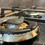 Why You Need To Clean The Grease & Grime Off Of Your Kitchen Appliances (And How To Do It)