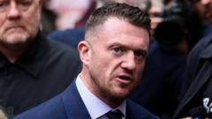 Tommy Robinson cleared of terror offence after not giving police access to his phone